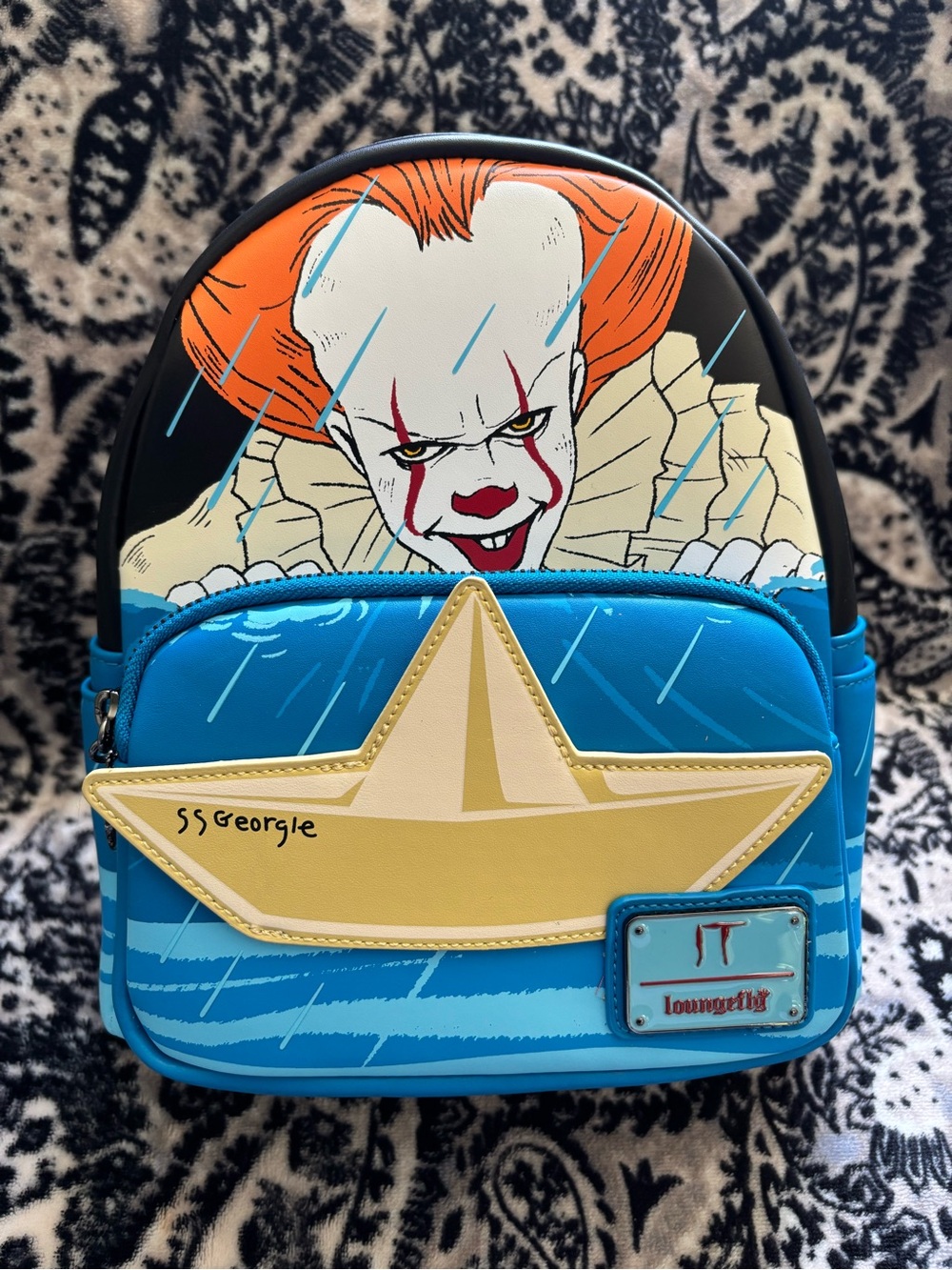 Loungefly Blue Backpack with Yellow Boat and Pennywise Graphic